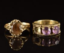 A 9ct gold ring set with smoky quartz (2g, size M) and a 14k gold ring set with amethysts (one