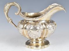 William IV hallmarked silver milk jug with embossed floral decoration, London 1836, maker Samuel