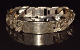 A 9ct gold curb link bracelet made up of textured links, Birmingham 1976, 101.4g