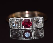 Victorian gold and silver ring set with a ruby of approximately 0.43ct and two rose cut diamonds,