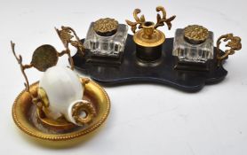 Victorian lacquered and gilt standish with ornate handles, tapered cut glass inkwells and a Japanned