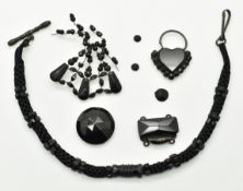 A 19thC fabric and jet watch chain, French jet heart padlock, and loose jet pieces