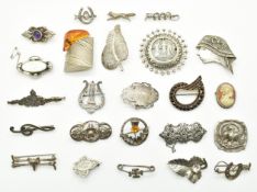 Twenty four silver brooches including WBs, Victorian Bohemian garnet, mother of pearl, pressed
