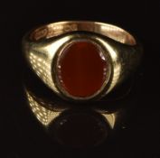 A 9ct gold signet ring set with carnelian agate, 5.3g, size N