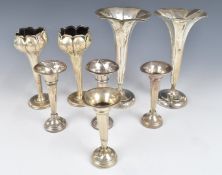 Four pairs of hallmarked silver trumpet vases, one pair formed as tulips, height of tallest 17cm
