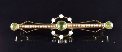 Edwardian 15ct gold brooch set with three peridots and seed pearls, 5.9g in vintage box
