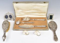 Hallmarked silver mounted items comprising hand mirror, brush and double photograph frame, further