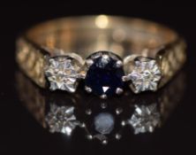 A 9ct gold ring set with a sapphire and diamonds, with textured shoulders, 3.5g, size P