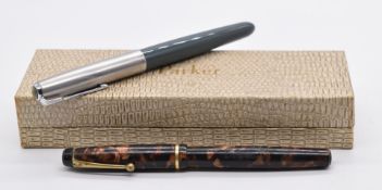 Two vintage fountain pens comprising a Parker 51 in original fitted box and a Wyvern Perfect No.8.