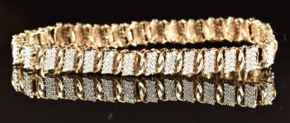 A 9ct gold bracelet set with two rows of diamonds interspersed with gold twists, 17.4g