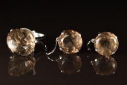 An 18k white gold ring set with smoky quartz, with matching earrings, 14.9g
