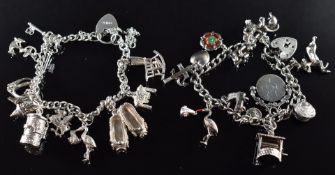 Two silver charm bracelets with over eighteen silver / white metal charms including mouse, anchor,