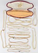 Fourteen faux pearl necklaces with 9ct gold clasps, one clasp set with seed pearls