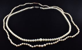 Two single strands of cultured pearls both with 9ct gold clasps