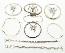 Five silver bangles, one set with amethysts, three silver bracelets and four silver brooches,