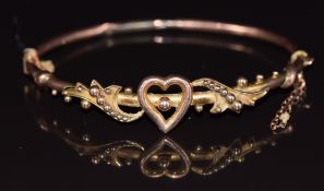 A 9ct rose gold bangle with heart and sphere decoration, in vintage box, 5.3g