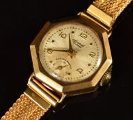 Accurist 9ct gold ladies wristwatch with gold hands and Arabic numerals, silver dial, octagonal case