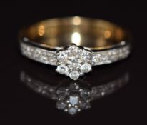 An 18ct gold ring set with diamonds in a cluster, 3.4g, size K