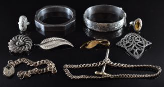 A collection of silver jewellery including octagonal bangle, bangle with engraved foliate