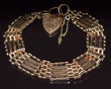 A 9ct gold gate bracelet with heart padlock clasp, 24.2g