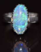 An 18ct white gold ring set with an oval opal cabochon, 5g, size J