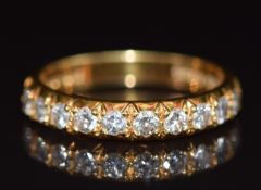 An 18ct gold half eternity ring set with diamonds, each approximately 0.05ct, 3.4g, size N
