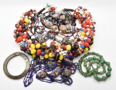 A large beaded glass necklace, two millefiori glass necklaces, aventurine quartz necklace and a
