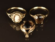 A 9ct gold ring set with a cameo, 9ct gold pendant set with smoky quartz and a 9ct gold ring set