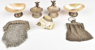 Pair of novelty white metal salts marked 925, each formed as shells surmounted by musical cherubs,