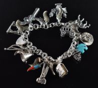 A silver charm bracelet with twelve silver charms from the USA including Arizona, Death Valley, etc,