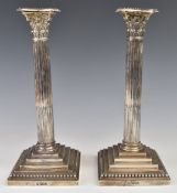 Pair of Edward VII hallmarked silver Corinthian column candlesticks with stepped and beaded bases,