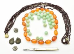 An amber necklace, garnet necklace, Victorian earring, fossil set earrings and jade beads