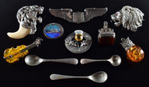 A silver brooch in the form of a lion, silver brooch set with butterfly wing 'T.S.S. Transylvania'