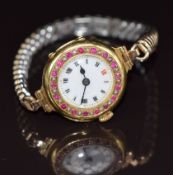 Edwardian 18ct gold wristwatch set with rubies and seed pearls, 23.4g.