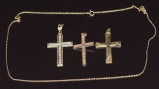 Three 9ct gold cross pendants and a 9ct gold chain, 8.4g