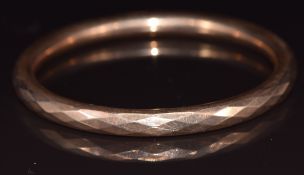 Art Deco 9ct rose gold flapper bangle with faceted decoration, Birmingham 1922, 21.1g