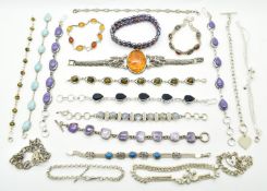 Twenty silver bracelets including labradorite, pressed amber, pearl, curb link, etc