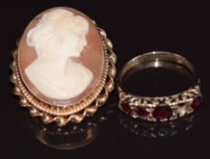 A 9ct gold brooch set with a cameo and a 9ct gold ring set with garnets (one garnet missing), 8.4g
