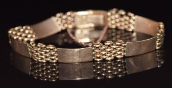 A 9ct rose gold bracelet made up of alternating panels and links, 16g