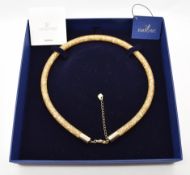 Swarovski necklace of woven netting design set with loose crystals, in box
