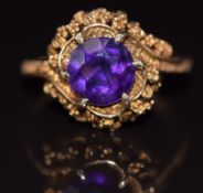 A 9ct gold ring set with a round cut amethyst, 4g, size O