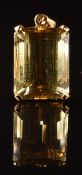 An 18k gold pendant set with a citrine of approximately 21.5ct, 7.6g