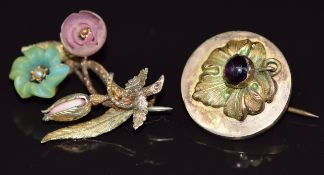 A yellow metal brooch in the form of flowers set with a seed pearl and a Victorian brooch