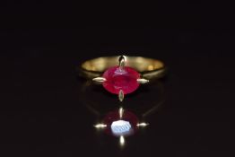 An 18ct gold ring set with an oval cut ruby of approximately 1.5ct, 3.7g, size M/N