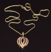 An 18k gold pendant set with round cut diamonds on 18k gold chain, 7.9g