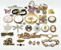 A collection of costume jewellery including brooches, rolled gold bangle, silver brooches, Miracle