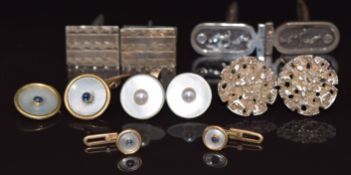 Three pairs of silver cufflinks, a pair of Mikimoto silver cufflinks, two yellow metal studs and a
