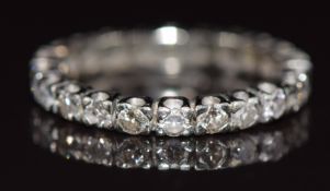 An 18ct white gold eternity ring set with 21 diamonds, each approximately 0.05ct (one diamond