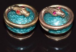 Two Victorian studs set with turquoise guilloché enamel with gold serpents set with ruby eyes, 2.9g