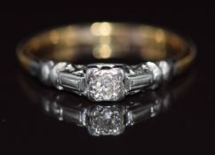 An 18ct gold ring set with a diamond in a platinum setting, 1.7g, size L